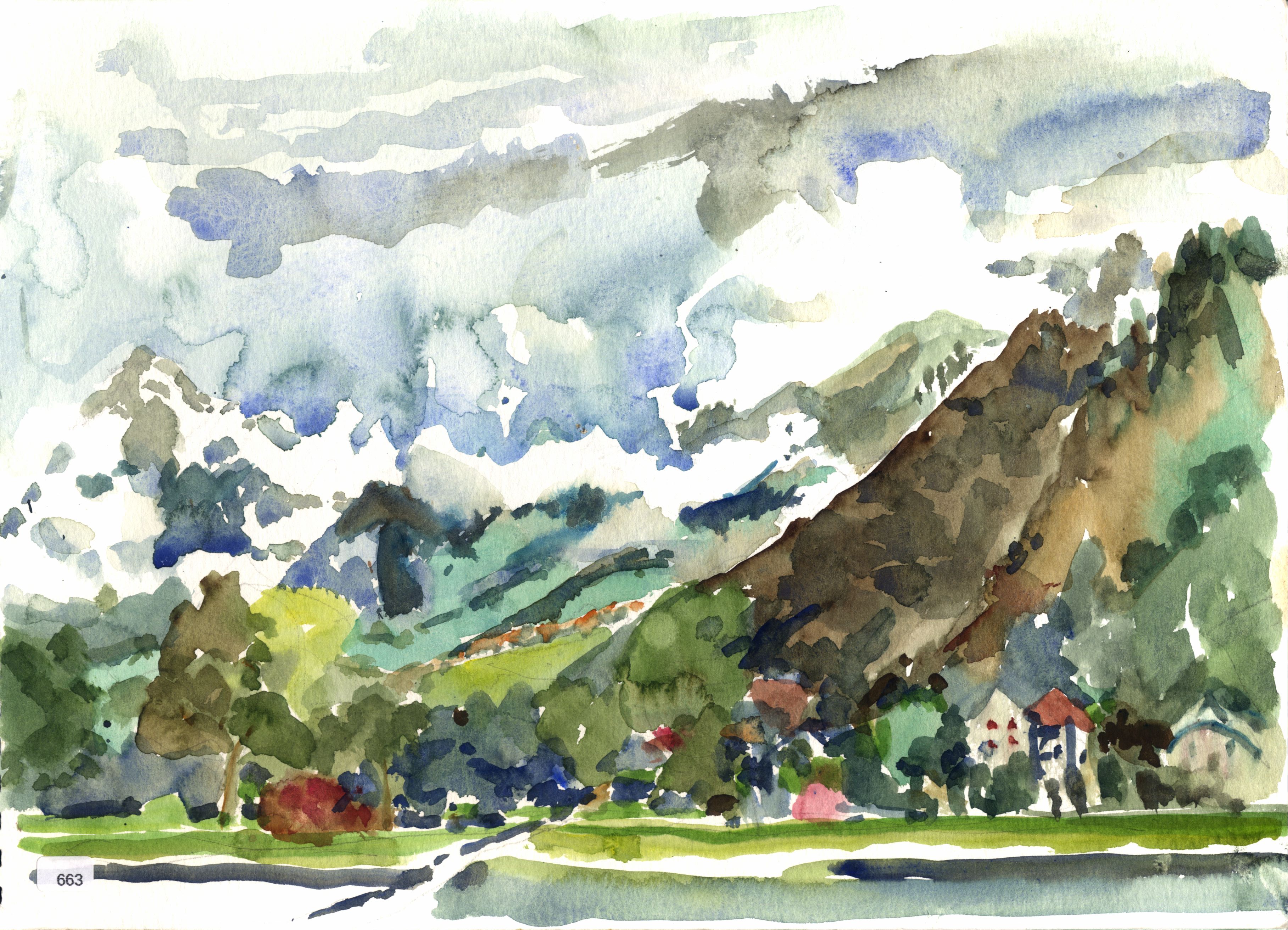 Village beneath mountain slope