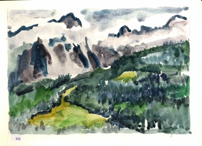 Mountain landscape with green valley, dark forested slopes, and snow-covered peaks under gray clouds.