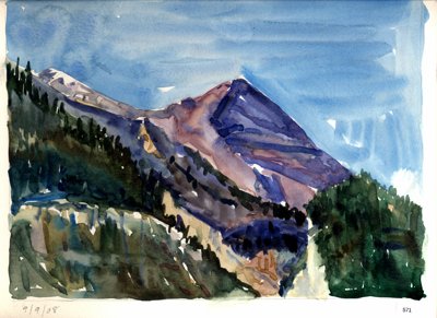 Alpine mountain with forested slopes