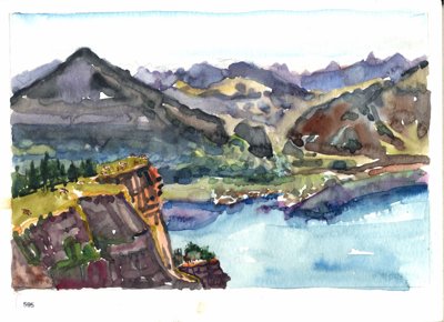 Lake and mountain landscape with blue water, steep slopes, and small lakeside buildings.