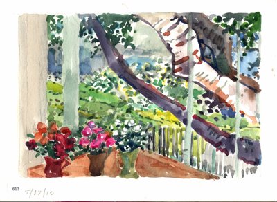 Porch scene with potted flowers, railing, trees, and garden beyond.