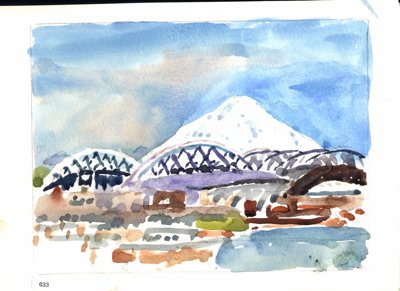 Snowy mountain rising behind arched bridge or industrial structure, with water and shoreline in foreground.