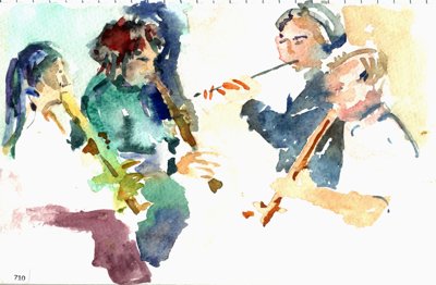 Group of musicians playing wind instruments.